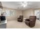 Bonus room features neutral walls, plush carpet, ceiling fan and comfortable seating at 1737 S Talbot --, Mesa, AZ 85209