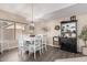 Cozy dining area featuring a stylish table, chandelier, and decorative hutch for a welcoming atmosphere at 1737 S Talbot --, Mesa, AZ 85209
