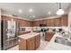 Functional kitchen with stainless steel appliances, a center island, and abundant storage solutions for organization at 1737 S Talbot --, Mesa, AZ 85209