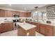 Attractive kitchen with stainless appliances, island, and coffee mug rack offering style and functionality at 1737 S Talbot --, Mesa, AZ 85209