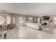 Open-concept living area with tile floors, a fireplace, and seamless access to the backyard patio at 1737 S Talbot --, Mesa, AZ 85209