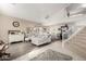 Open-concept living room featuring tiled floors, a staircase, and a comfortable seating area at 1737 S Talbot --, Mesa, AZ 85209