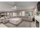 Spacious living room with a large sectional sofa, fireplace, and open layout ideal for entertaining guests at 1737 S Talbot --, Mesa, AZ 85209