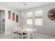 Bright dining area features modern chandelier and natural light at 17784 W Sandy Rd, Goodyear, AZ 85338