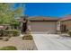 Charming single-story home with a two-car garage, desert landscaping, and a welcoming front entrance at 17784 W Sandy Rd, Goodyear, AZ 85338