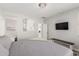 Comfortable main bedroom with neutral decor, a decorative chandelier, and an en-suite bathroom at 17784 W Sandy Rd, Goodyear, AZ 85338
