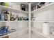 Spacious pantry with ample shelving for organized storage of food and household items at 17784 W Sandy Rd, Goodyear, AZ 85338