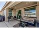 Relaxing covered patio space with comfortable seating and outdoor living area at 17784 W Sandy Rd, Goodyear, AZ 85338