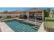 Inviting backyard pool with elegant fountains and patio furniture for outdoor enjoyment at 17784 W Sandy Rd, Goodyear, AZ 85338