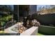 Lush backyard garden featuring a rock waterfall and desert landscaping at 1805 E Rocky Slope Dr, Phoenix, AZ 85048