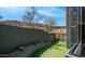 Private turf backyard area featuring a desert landscape and view fencing at 1805 E Rocky Slope Dr, Phoenix, AZ 85048
