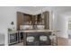 Wet bar area with stone counter, custom cabinets, and wine cooler at 1805 E Rocky Slope Dr, Phoenix, AZ 85048