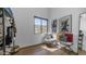 Bright bedroom features hardwood floors, and an open closet area filled with designer clothing and accessories at 1805 E Rocky Slope Dr, Phoenix, AZ 85048