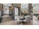 Open concept dining area with staircase and views of the desert landscape at 1805 E Rocky Slope Dr, Phoenix, AZ 85048