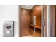 The property includes a modern, interior elevator with wooden panels and buttons for easy accessibility at 1805 E Rocky Slope Dr, Phoenix, AZ 85048