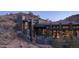 Stunning modern home featuring stone accents, an outdoor seating area and well-manicured landscaping at 1805 E Rocky Slope Dr, Phoenix, AZ 85048