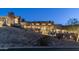 Striking nighttime view of hillside home with multiple levels and scenic lighting at 1805 E Rocky Slope Dr, Phoenix, AZ 85048