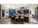 A modern kitchen with stainless steel appliances, granite counters and a large kitchen island with barstool seating at 1805 E Rocky Slope Dr, Phoenix, AZ 85048