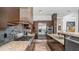 A contemporary kitchen featuring granite countertops, stainless steel appliances, and dark wood cabinetry at 1805 E Rocky Slope Dr, Phoenix, AZ 85048