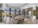 Bright living area featuring floor-to-ceiling windows, designer furnishings, and seamless indoor-outdoor living at 1805 E Rocky Slope Dr, Phoenix, AZ 85048