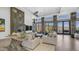 Spacious living room with fireplace, natural light, and access to the patio, creating an inviting and airy atmosphere at 1805 E Rocky Slope Dr, Phoenix, AZ 85048