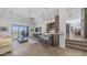 Open-concept living room with a bar area, a ceiling fan, tile floors and a large window with mountain views at 1805 E Rocky Slope Dr, Phoenix, AZ 85048
