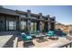 Relaxing patio with comfortable seating, a water feature, and scenic views of the desert landscape at 1805 E Rocky Slope Dr, Phoenix, AZ 85048