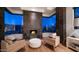 Modern sitting area with floor to ceiling windows and a sleek fireplace and desert views at 1805 E Rocky Slope Dr, Phoenix, AZ 85048