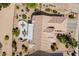 Bird's-eye view of a home with a patio, built-in kitchen, and desert landscaping at 18514 N Laguna Azul Ct, Surprise, AZ 85374