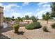 Enjoy an expansive desert landscaped backyard with views of the golf course from your patio at 18514 N Laguna Azul Ct, Surprise, AZ 85374
