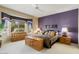 Comfortable bedroom with bay window, soft carpet, and a soothing color scheme at 18514 N Laguna Azul Ct, Surprise, AZ 85374
