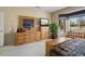 Relaxing bedroom showcases a dresser, bay window, and a calm atmosphere at 18514 N Laguna Azul Ct, Surprise, AZ 85374