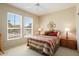 Cozy bedroom with natural light from large windows, creating a relaxing atmosphere at 18514 N Laguna Azul Ct, Surprise, AZ 85374