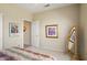 Bedroom featuring neutral walls and carpet, ceiling fan, and ample closet space at 18514 N Laguna Azul Ct, Surprise, AZ 85374