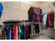 Walk-in closet with ample hanging space and shelving for optimal storage at 18514 N Laguna Azul Ct, Surprise, AZ 85374