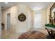 Spacious entryway features decorative lighting, neutral paint colors, and tile flooring at 18514 N Laguna Azul Ct, Surprise, AZ 85374