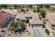 Well-maintained home featuring a tile roof, desert landscaping, and a two-car garage at 18514 N Laguna Azul Ct, Surprise, AZ 85374