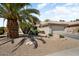 Home with xeriscaping, featuring a two-car garage and desert plants at 18514 N Laguna Azul Ct, Surprise, AZ 85374