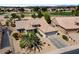 Aerial view showing the landscaped front yard and tile roof at 18514 N Laguna Azul Ct, Surprise, AZ 85374