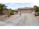 Charming single-Gathering home with mature palm trees and xeriscaped front yard at 18514 N Laguna Azul Ct, Surprise, AZ 85374