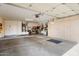 Spacious garage with ample storage cabinets and room for bikes and tools at 18514 N Laguna Azul Ct, Surprise, AZ 85374