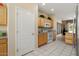 Kitchen with wooden cabinets, white appliances, and a convenient layout at 18514 N Laguna Azul Ct, Surprise, AZ 85374