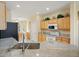 Well-lit kitchen with granite countertops, ample cabinet space, and modern appliances at 18514 N Laguna Azul Ct, Surprise, AZ 85374