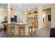 Bright kitchen features granite countertops, stainless steel appliances, and a breakfast bar at 18514 N Laguna Azul Ct, Surprise, AZ 85374