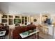 Spacious living room boasts custom built-ins, an open floor plan, and modern decor at 18514 N Laguna Azul Ct, Surprise, AZ 85374