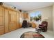 Comfortable office with built in cabinets and Murphy bed at 18514 N Laguna Azul Ct, Surprise, AZ 85374