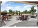 Inviting outdoor patio with built in barbeque and ample seating area for entertaining at 18514 N Laguna Azul Ct, Surprise, AZ 85374