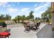 This open patio offers ample seating with a built-in outdoor cooking area and views to the golf course at 18514 N Laguna Azul Ct, Surprise, AZ 85374
