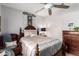 Cozy bedroom featuring a decorative headboard, dresser, and chair, creating a relaxing retreat at 18867 N Cactus Flower Way, Surprise, AZ 85387