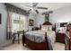 Cozy bedroom with decorative details, window shutters, and ceiling fan at 18867 N Cactus Flower Way, Surprise, AZ 85387